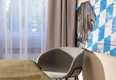 Ein Bett oder Betten in einem Zimmer der Unterkunft ibis Styles Rosenheim