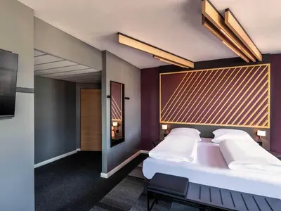 Ein Bett oder Betten in einem Zimmer der Unterkunft B&B HOTEL München-Schwabing