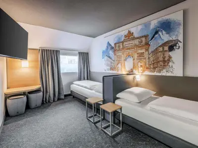 Ein Bett oder Betten in einem Zimmer der Unterkunft B&B HOTEL München-Schwabing