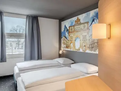 Ein Bett oder Betten in einem Zimmer der Unterkunft B&B HOTEL München-Schwabing