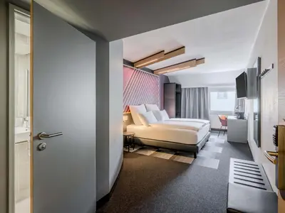 Ein Bett oder Betten in einem Zimmer der Unterkunft B&B HOTEL München-Schwabing