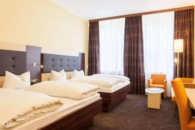Ein Bett oder Betten in einem Zimmer der Unterkunft Best Western Hotel Augusta