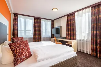 Ein Bett oder Betten in einem Zimmer der Unterkunft Best Western Hotel Augusta