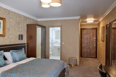 Ein Bett oder Betten in einem Zimmer der Unterkunft Atlas Posthotel