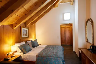 Ein Bett oder Betten in einem Zimmer der Unterkunft Atlas Posthotel