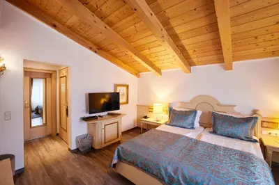 Ein Bett oder Betten in einem Zimmer der Unterkunft Atlas Posthotel