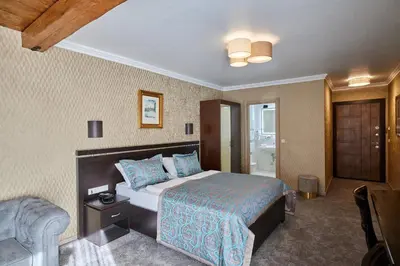 Ein Bett oder Betten in einem Zimmer der Unterkunft Atlas Posthotel
