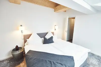 Ein Bett oder Betten in einem Zimmer der Unterkunft Sonnhof - Luxus Alpine Penthouse, neu möbliert
