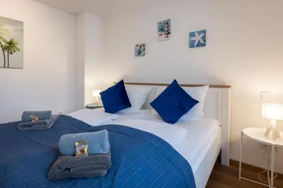 Ein Bett oder Betten in einem Zimmer der Unterkunft Arbio I Cozy Apartments Augsburg-Lechhausen