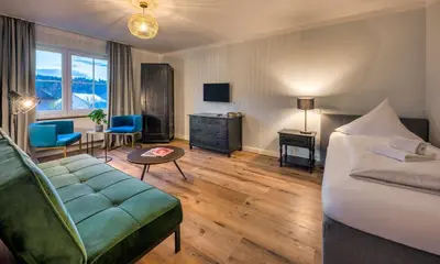 Ein Bett oder Betten in einem Zimmer der Unterkunft Hotel Schmiedhubers