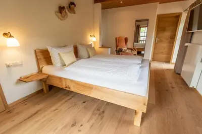 Ein Bett oder Betten in einem Zimmer der Unterkunft Gästehaus Neu am Passionstheater
