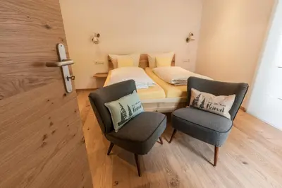 Ein Bett oder Betten in einem Zimmer der Unterkunft Gästehaus Neu am Passionstheater