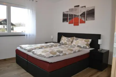 Ein Bett oder Betten in einem Zimmer der Unterkunft Alpenblick Ferienwohnung