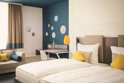 Ein Bett oder Betten in einem Zimmer der Unterkunft Vienna House Easy by Wyndham Landsberg
