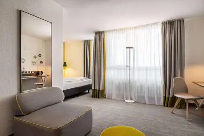 Ein Bett oder Betten in einem Zimmer der Unterkunft Vienna House Easy by Wyndham Landsberg