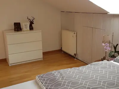 Ein Bett oder Betten in einem Zimmer der Unterkunft Ferienwohnung am Starnberger See