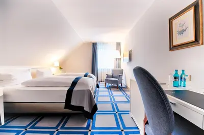 Ein Bett oder Betten in einem Zimmer der Unterkunft Hotel SchreiberHof