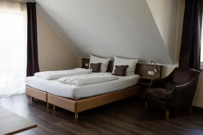 Ein Bett oder Betten in einem Zimmer der Unterkunft Gästehaus Lemerhof