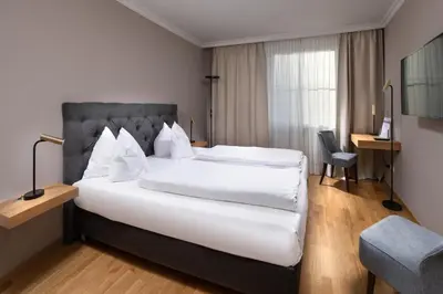 Ein Bett oder Betten in einem Zimmer der Unterkunft Hotel Goldene Sonne