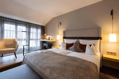 Ein Bett oder Betten in einem Zimmer der Unterkunft Hotel Goldene Sonne