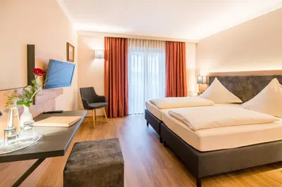 Ein Bett oder Betten in einem Zimmer der Unterkunft Hotel-Gasthof Huber