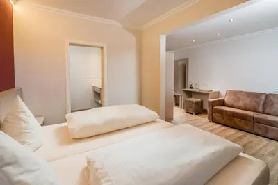 Ein Bett oder Betten in einem Zimmer der Unterkunft Hotel-Gasthof Huber