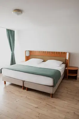 Ein Bett oder Betten in einem Zimmer der Unterkunft Hotel Cristallo