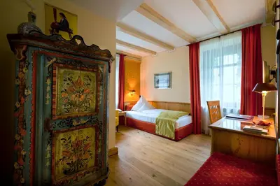 Ein Bett oder Betten in einem Zimmer der Unterkunft Simones Hotel Fürstenhof