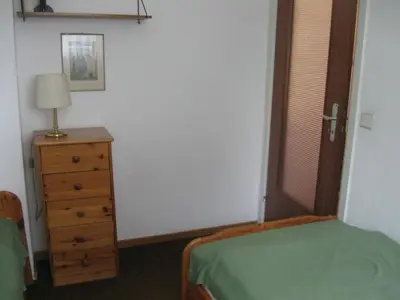 Ein Bett oder Betten in einem Zimmer der Unterkunft Ferienwohnung Plaggemars Verm nur Sonntag auf Samstag