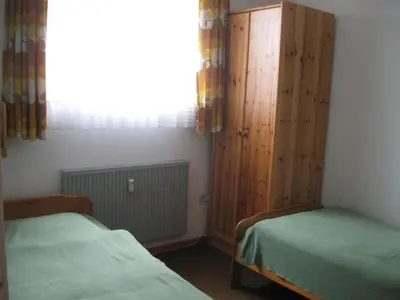Ein Bett oder Betten in einem Zimmer der Unterkunft Ferienwohnung Plaggemars Verm nur Sonntag auf Samstag