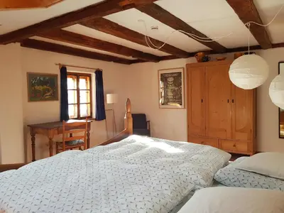 Ein Bett oder Betten in einem Zimmer der Unterkunft Ferienwohnung Hofen 5