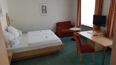Ein Bett oder Betten in einem Zimmer der Unterkunft Hotel Gasthof Specht