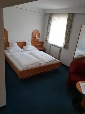 Ein Bett oder Betten in einem Zimmer der Unterkunft Hotel Gasthof Specht