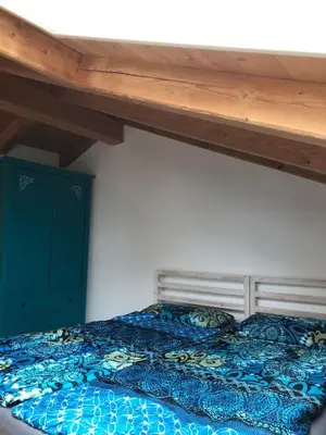 Ein Bett oder Betten in einem Zimmer der Unterkunft Ferienwohnung am Chiemsee