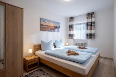 Ein Bett oder Betten in einem Zimmer der Unterkunft Zweizimmer Erdgeschoss Wohnung mit Terrasse 4