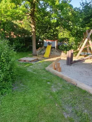 Ein Garten an der Unterkunft Ferienwohnanlage Brünnstein Wohnung 54