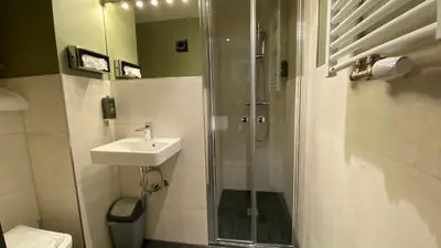 Ein Badezimmer in der Unterkunft Munich Rooms Hotel
