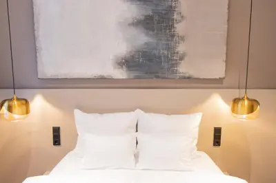 Ein Bett oder Betten in einem Zimmer der Unterkunft Munich Rooms Hotel