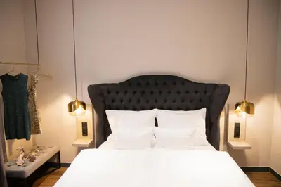 Ein Bett oder Betten in einem Zimmer der Unterkunft Munich Rooms Hotel