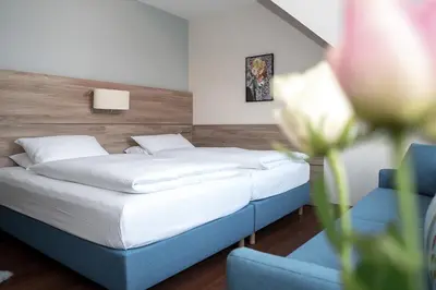 Ein Bett oder Betten in einem Zimmer der Unterkunft Hotel Kastanienhof
