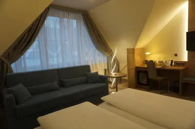 Ein Sitzbereich in der Unterkunft Hotel Kastanienhof