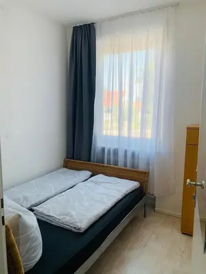Ein Bett oder Betten in einem Zimmer der Unterkunft Großartige 3 Zimmer Ferienwohnung mit Kamin und Garten für 1-6 Personen