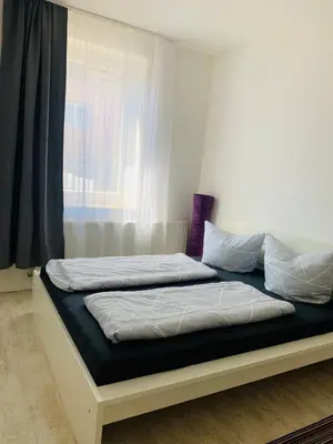 Ein Bett oder Betten in einem Zimmer der Unterkunft Großartige 3 Zimmer Ferienwohnung mit Kamin und Garten für 1-6 Personen