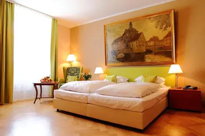 Ein Bett oder Betten in einem Zimmer der Unterkunft Hotel Rappensberger