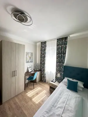 Ein Bett oder Betten in einem Zimmer der Unterkunft Hotel Rappensberger