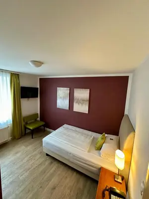 Ein Bett oder Betten in einem Zimmer der Unterkunft Hotel Rappensberger