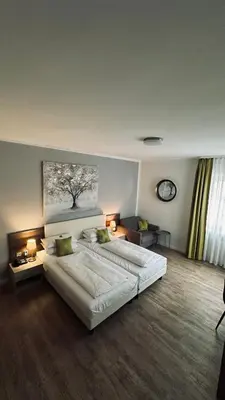 Ein Bett oder Betten in einem Zimmer der Unterkunft Hotel Rappensberger