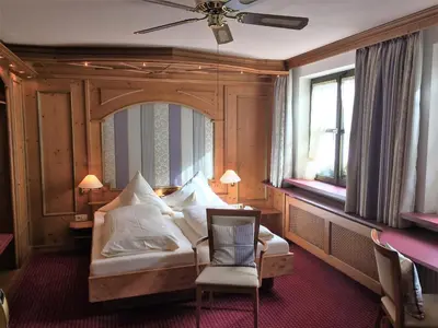 Ein Bett oder Betten in einem Zimmer der Unterkunft Hotel Augsburger Hof