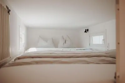 Ein Bett oder Betten in einem Zimmer der Unterkunft Tiny House Lebenshofalpakas