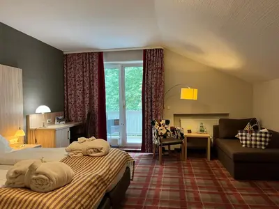 Ein Bett oder Betten in einem Zimmer der Unterkunft Ringhotel Sonneck
